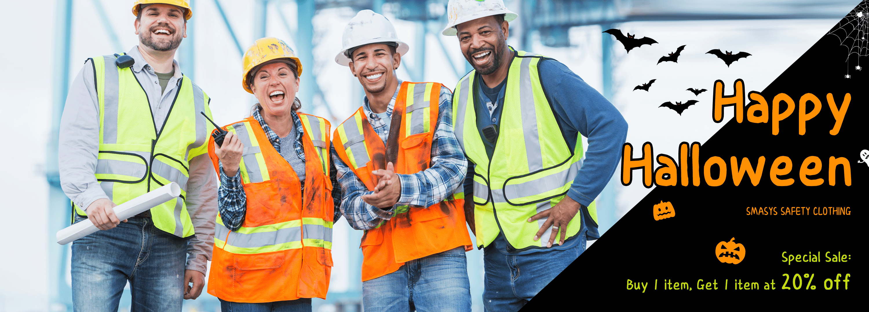 Four construction workers in safety gear with a Halloween-themed banner.